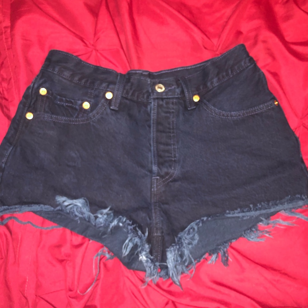 Dark blue mid rise Levi’s shorts